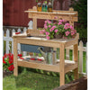 Handcrafted outdoor cypress wooden potting table with smooth unfinished wood, featuring shelving, hooks for tools, and decorative flowers, perfect for garden accessories and farm use.