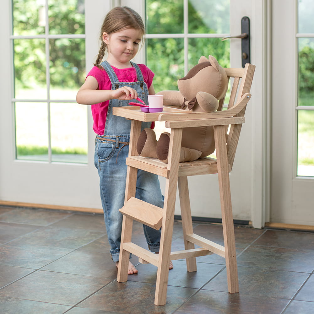 Child playing with a handcrafted Amish-made wooden doll high chair, feeding a stuffed bear, showcasing unique quality in Toys, USA Made, Children's Toys, and Best Sellers collections.