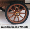 Close-up of a handcrafted wooden spoke wheel with solid rubber tire, part of specialty equipment and kitchen & food collections for making ice cream.