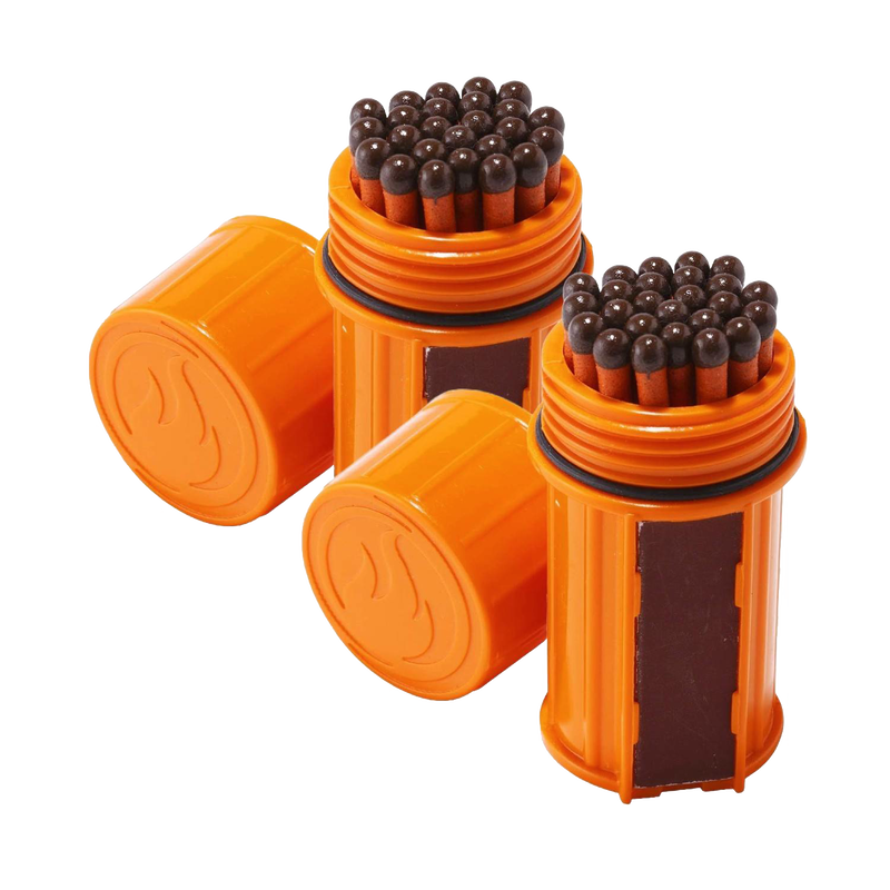 Two orange waterproof containers each filled with tightly packed brown-headed matches and equipped with built-in striking surfaces, designed for reliable outdoor use in camping and emergency supplies.