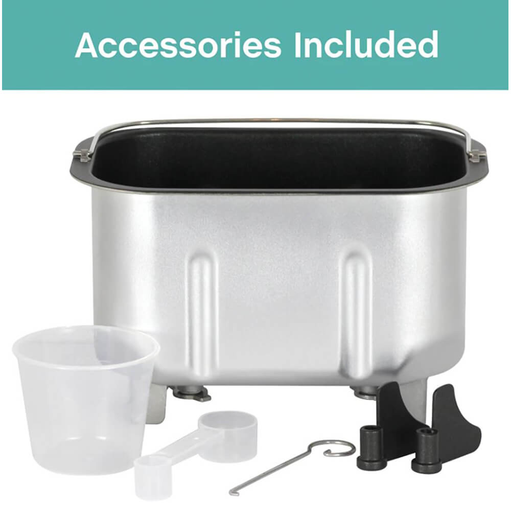 Silver bread maker pan with nonstick interior alongside clear measuring cup, plastic measuring spoon, kneading blade, and metal hook for bread making supplies in kitchen gadget collections