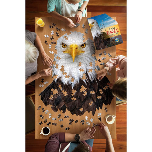 Top-down view of four people assembling a uniquely shaped eagle head jigsaw puzzle with 550 pieces, surrounded by drinks and the puzzle box, ideal for toys, games, and best sellers collections.