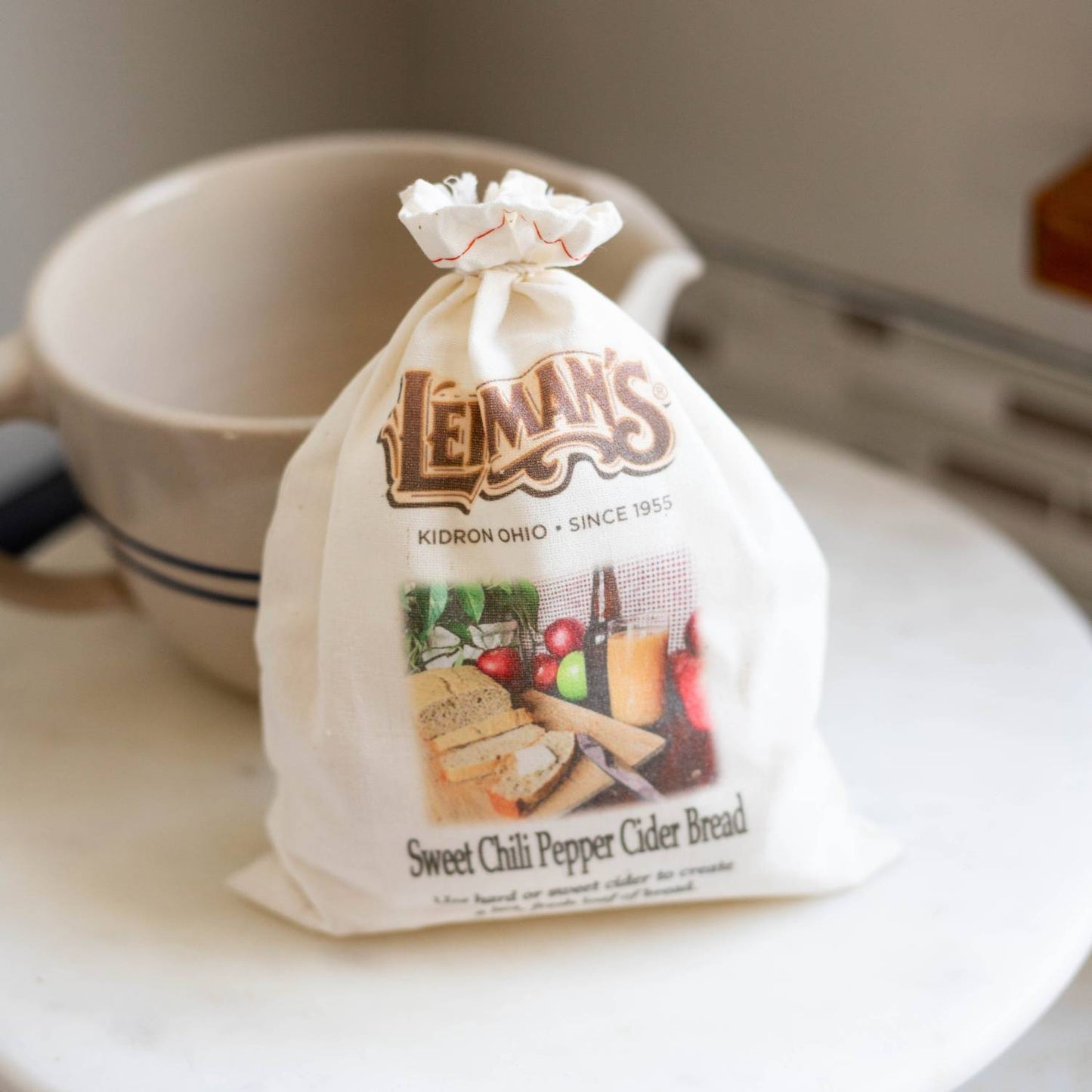 Natural fabric drawstring bag containing handcrafted Sweet Chili Pepper Cider bread mix, featuring rustic imagery, ideal for Kitchen & Food, Pantry, Dry Goods and Mixes, Best Sellers, Promo Eligible collections.