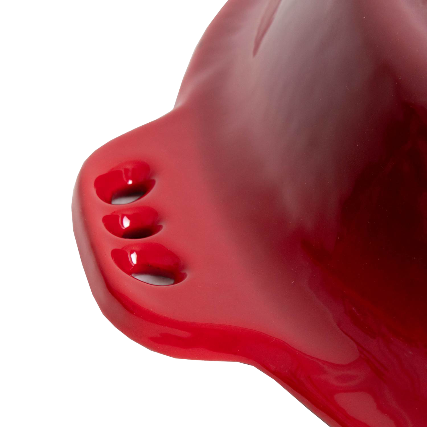 Close-up of a handcrafted red cast iron pie pan handle with three ventilation holes and a smooth glossy finish, ideal for Kitchen & Food, Cast Iron, Cookware, Baking Supplies, Best Sellers, and Promo Eligible collections.
