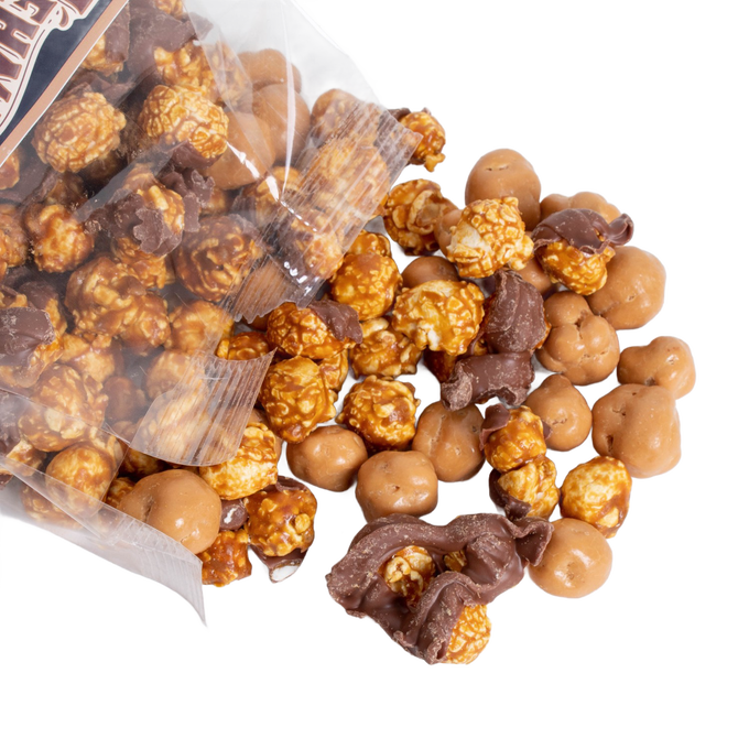 Clear bag spilling handcrafted caramel popcorn with assorted chocolate-coated pieces, a unique Amish-made sweet and crunchy treat featured in Kitchen & Food, Snacks and Sweets, Popcorn, USA Made, and Best Sellers collections.