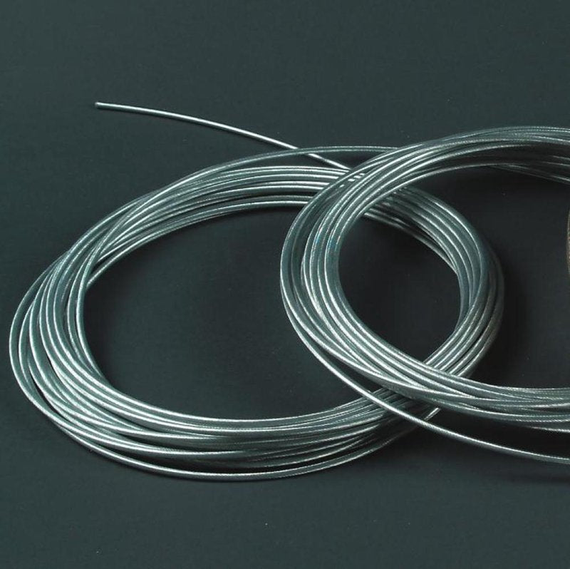 Two coils of durable 19-strand galvanized wire cable with silver vinyl coating, designed for long-lasting use in home decor, laundry supplies, and clothesline accessories.