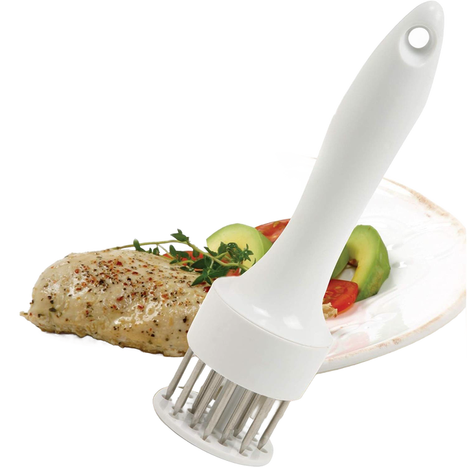 White plastic-handled meat tenderizer with 24 stainless-steel prongs positioned on a plate next to seasoned cooked poultry, part of Kitchen Gadgets and Butchering Supplies collections.
