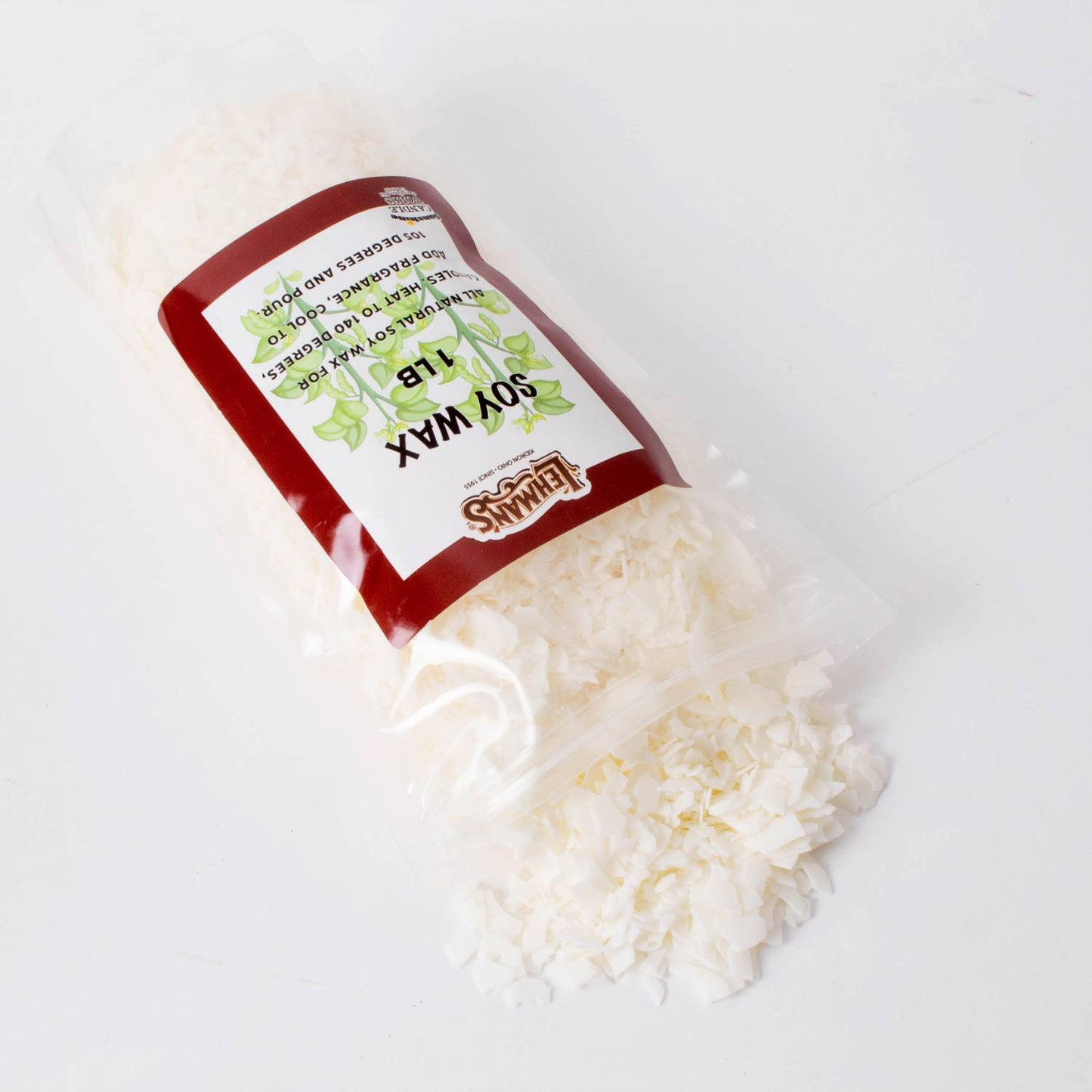 Clear bag spilling handcrafted soy candle wax pellets with a maroon and white label, featured in Lamps & Lighting, Candles and Candlemaking, Candlemaking Supplies, Best Sellers, and Promo Eligible collections.