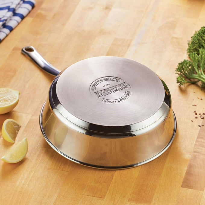 Polished stainless steel frying pan with ergonomic handle and fully encapsulated aluminum base for even heat distribution, featured in Kitchen & Food and Cookware collections.