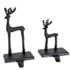 Pair of handcrafted black iron deer stocking holders in two sizes with sturdy bases and hooks, designed for Home & Decor, Holiday Decor, Best Sellers, and Promo Eligible collections.