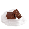 Two pieces of creamy chocolate fudge with visible nut pieces, presented on a decorative white paper doily, showcasing a handcrafted treat from USA-made snack collections.