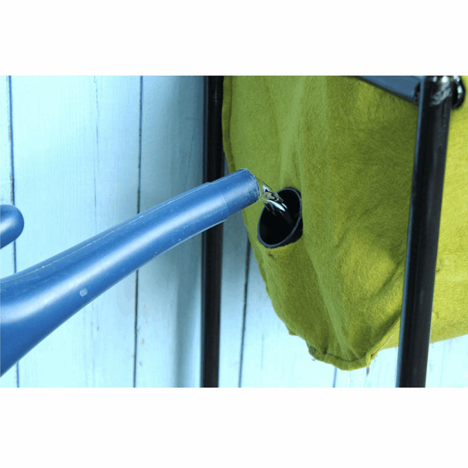 Blue watering can pouring water into the hidden reservoir of a green fabric planter on a black metal frame, part of Farm, Garden & Tool and Garden Accessories collections.