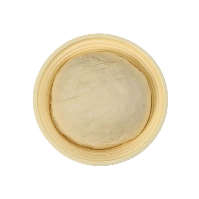 Light-colored collapsible proofing basket made from silicone with steel rim, holding round dough rising, ideal for Kitchen & Food and Baking Supplies collections.