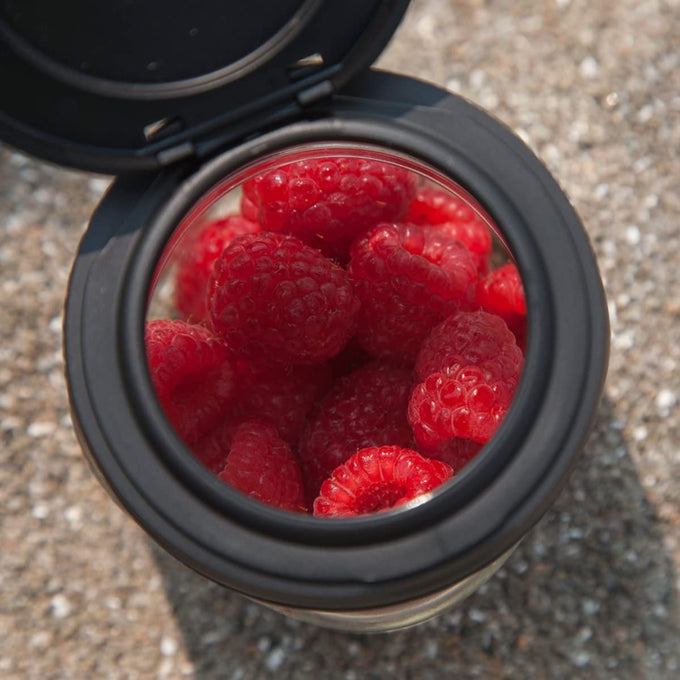 Close-up of fresh raspberries inside a clear jar topped with a handcrafted black flip top lid, made in USA, ideal for Home & Decor, Kitchen Gadgets, Storage and Serving collections.