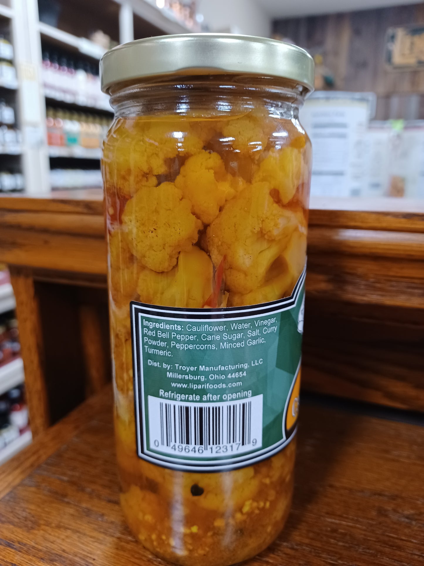 Glass jar filled with handcrafted sweet pickled cauliflower and red bell peppers in a vibrant brine, made in USA, featured in Kitchen & Food, Pantry, and Best Sellers collections.