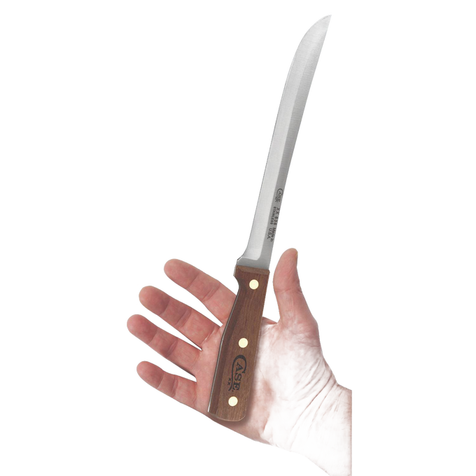 Hand holding a 9-inch precision slicing knife with a wooden handle featuring brass rivets, designed for accurate food preparation in kitchen and farm tool collections.