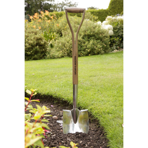 Stainless steel planting spade with a pointed blade featuring depth markings and a sturdy double-riveted wooden handle, designed for garden beds, borders, and planting tasks in Farm, Garden & Tool and Seeds and Planting collections.