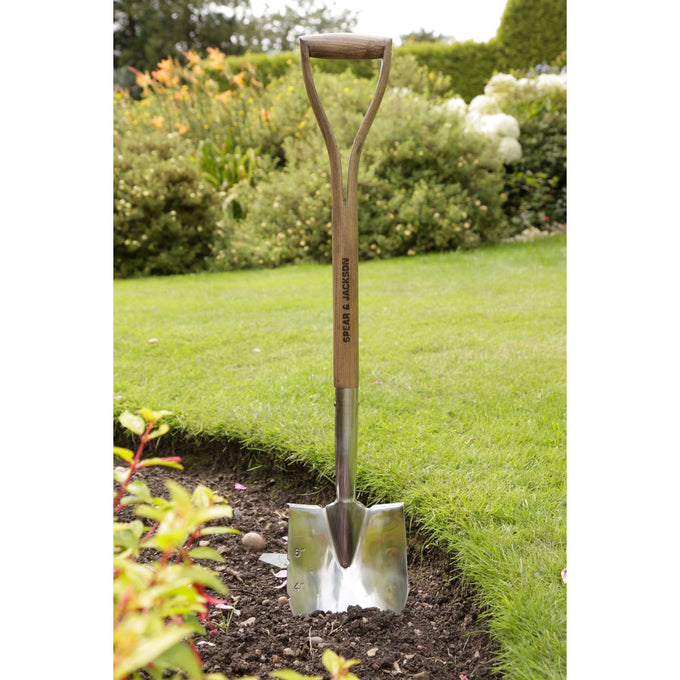 Stainless steel planting spade with a pointed blade featuring depth markings and a sturdy double-riveted wooden handle, designed for garden beds, borders, and planting tasks in Farm, Garden & Tool and Seeds and Planting collections.