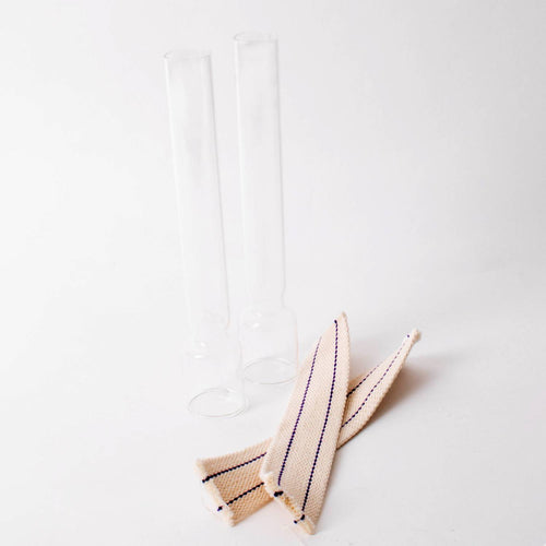 Two clear replacement chimneys and two striped flat wicks for oil lamps, featured in Lamps & Lighting, Oil Lamps, Table Lamps, Best Sellers, and Promo Eligible collections.