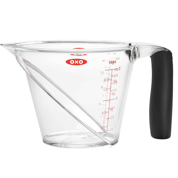 Clear angled measuring cup with red measurement markings up to 2 cups, featuring a soft black grip handle, designed for Kitchen & Food, Food Prep, Measuring, and Best Sellers collections.