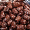 Close-up of root beer barrel-shaped hard candies with a glossy finish, evoking nostalgic flavors, featured in Kitchen & Food, Snacks and Sweets, Food, Best Sellers, and Promo Eligible collections.