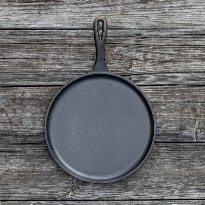 Handcrafted old-style round cast iron griddle with flat bottom for even heat conduction, made in USA, ideal for Kitchen & Food, Cookware, Cast Iron, and Best Sellers collections.