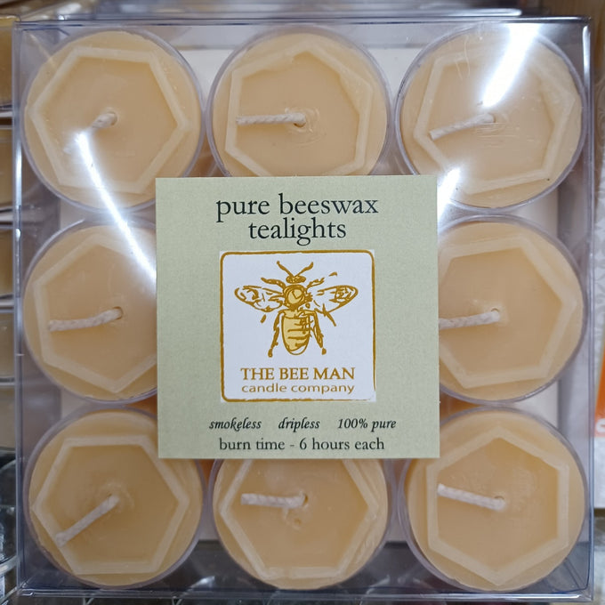 Box of nine handcrafted pure beeswax tealight candles with natural honey color, smokeless and dripless for up to six hours burn time, featured in USA Made and Candles collections.