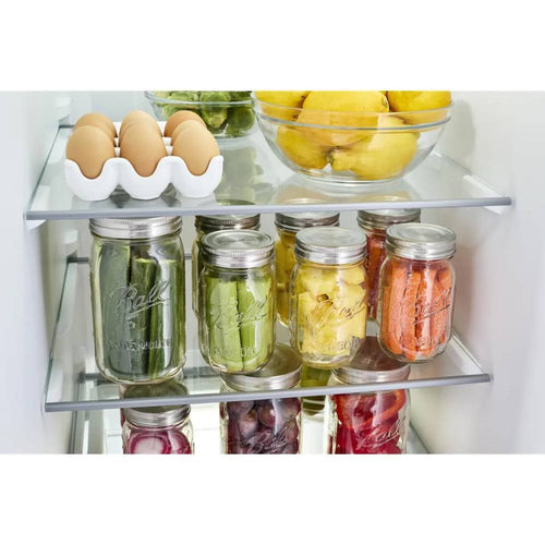 Set of three rust-proof stainless steel wide mouth jar lids with silicone gaskets sealing jars of preserved vegetables, displayed in a refrigerator, ideal for Kitchen & Food and Storage collections.