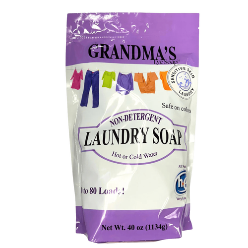 Purple and white resealable bag of Grandma's all-natural laundry soap featuring colorful clothes illustrations, labeled safe for sensitive skin and colors, suitable for use in hot or cold water, ideal for Home & Decor and Laundry Supplies collections.