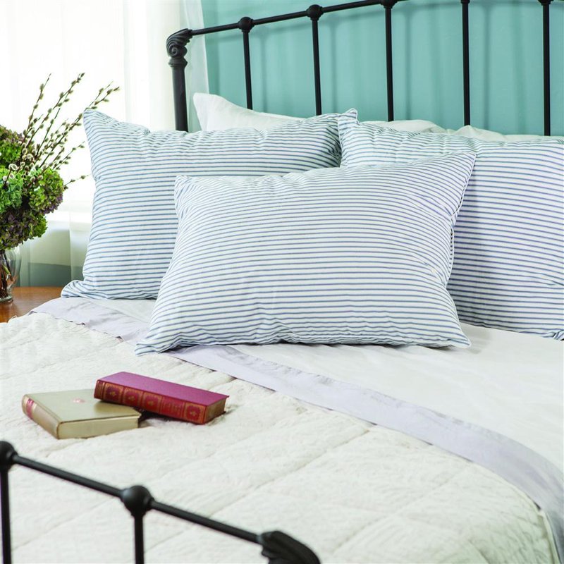 Soft, generously filled down pillows with white and blue striped covers arranged on a classic iron bed frame in a cozy bedroom setting, featured in Home & Decor and Home Textiles collections.