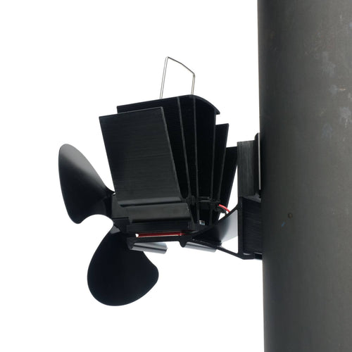Black heat-activated magnetic fan with three blades mounted on a stove flue pipe, designed to circulate warm air efficiently; featured in Stoves, Hearth Accessories, Best Sellers, Promo Eligible collections.
