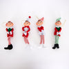 Four posable retro-style Christmas elf ornaments in red, white, and green festive outfits with striped tights, fabric bodies, and hanging cords, featured in holiday decor collections.