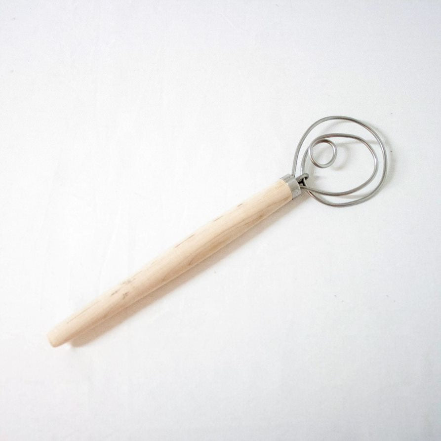 Handcrafted Old Country dough whisk with a smooth wooden handle and dual spiral metal wires, Amish made in USA, ideal for baking supplies, kitchen gadgets, and cookware collections.