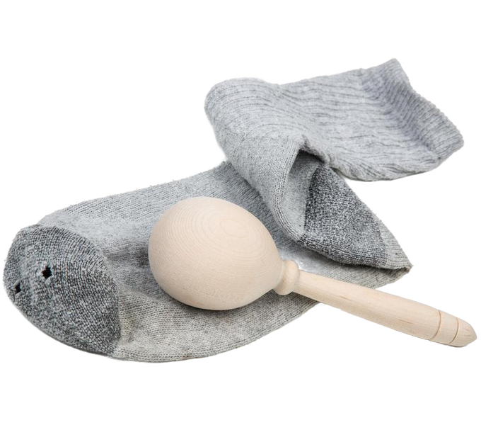 Handcrafted wooden sock darner ball with natural finish placed inside a gray sock showing its use for mending, featured in Sewing and Quilting, Home & Decor, USA Made, and Amish Made collections.