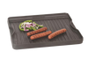 Small cast iron grill with ridged cooking surface holding grilled hot dogs and sliced green bell peppers and onions, ideal for Kitchen & Food and Cast Iron cookware collections.