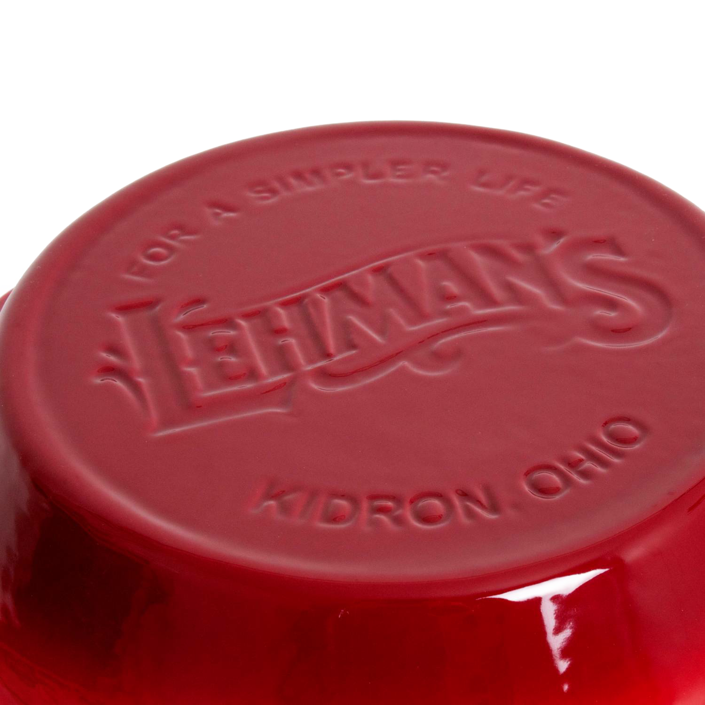 Close-up of the bottom of a handcrafted red cast iron pan embossed with Lehman’s logo and Kidron Ohio, highlighting durable Amish-made cookware for Kitchen & Food, Cast Iron, and Best Sellers collections.