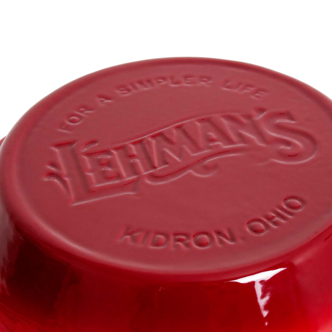 Close-up of the bottom of a handcrafted red cast iron pan embossed with Lehman’s logo and Kidron Ohio, highlighting durable Amish-made cookware for Kitchen & Food, Cast Iron, and Best Sellers collections.