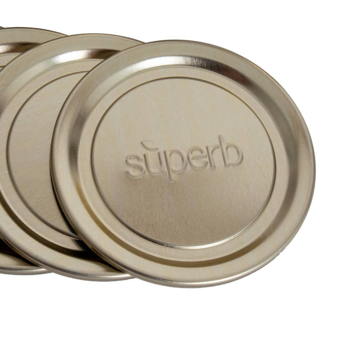 Set of twelve smooth metal canning jar lids embossed with the word superb, designed for food preservation and kitchen use in USA Made, Canning, and Best Sellers collections.