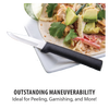 Paring knife with a smooth black handle and sharp non-serrated blade resting on a white plate with fresh taco ingredients, highlighting kitchen and food prep use.