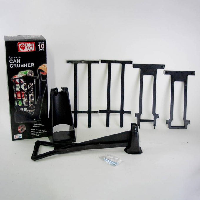Components of a heavy-duty black plastic can crusher including a large lever, support brackets, mounting hardware, and product packaging, featured in Home & Decor, Household Helpers, USA Made, Best Sellers, and Promo Eligible collections.