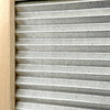 Close-up of a galvanized metal washboard with wavy ridges set in a mortised wooden frame, designed for effective stain removal, part of Laundry Supplies and USA Made collections.