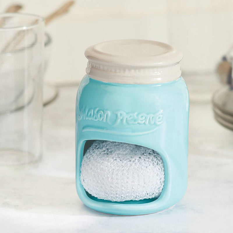 Light blue ceramic mason jar-shaped sponge holder with a cream-colored lid, featuring a compartment for a white sponge, perfect for kitchen accessories and household helpers collections.