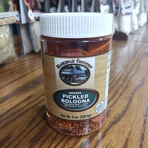 Clear plastic jar of handcrafted smoked pickled bologna with a white lid, featuring a rustic label and mustard seeds, ideal for Kitchen & Food, Meats, USA Made, and Best Sellers collections.