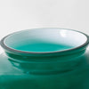 Close-up of a handcrafted emerald glass lamp shade with smooth edges, designed for Aladdin hanging lamps, featured in Lamps & Lighting and Parts and Accessories collections.