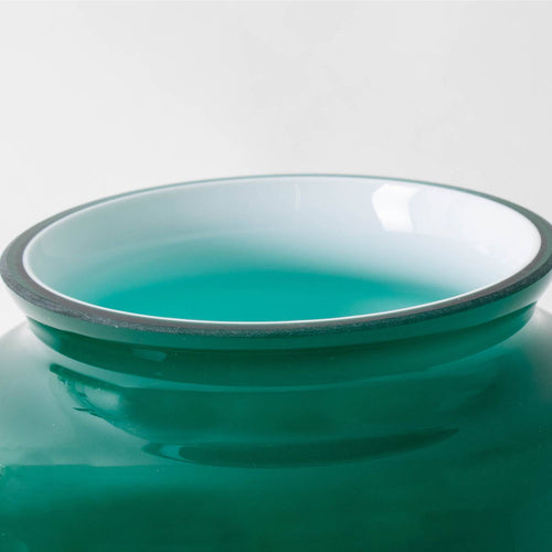 Close-up of a handcrafted emerald glass lamp shade with smooth edges, designed for Aladdin hanging lamps, featured in Lamps & Lighting and Parts and Accessories collections.