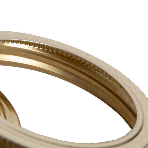 Close-up of a set of smooth, gold-toned metal jar bands with ridged inner edges, crafted in USA and perfect for Kitchen & Food, Food Preservation, and Canning collections.