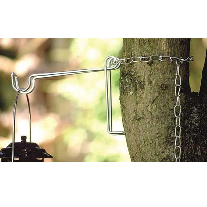 Metal lantern hanger with a secure chain attachment wrapped around a tree trunk, designed to suspend lamps from above for enhanced outdoor lighting, suitable for camping and emergency use.