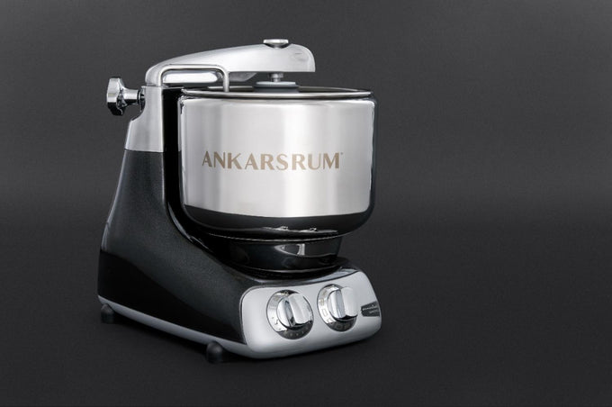 Black and silver stand mixer with polished stainless steel bowl and dual control dials, designed for heavy-duty baking tasks; featured in Kitchen & Food, Baking Supplies, and Cooking and Baking Helpers collections.