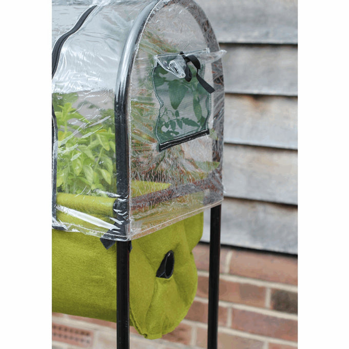 Compact raised fabric planter with green growing bed on black metal frame, featuring a clear polyethylene greenhouse cover and built-in water reservoir, ideal for small patios and balconies in Farm, Garden & Tool and Garden Accessories collections.
