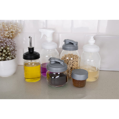 Seven-piece set of durable, eco-friendly reCAP lids in black, gray, and white styles on glass jars and bottles, handcrafted in USA for Home & Decor, Household Helpers, and Best Sellers collections.
